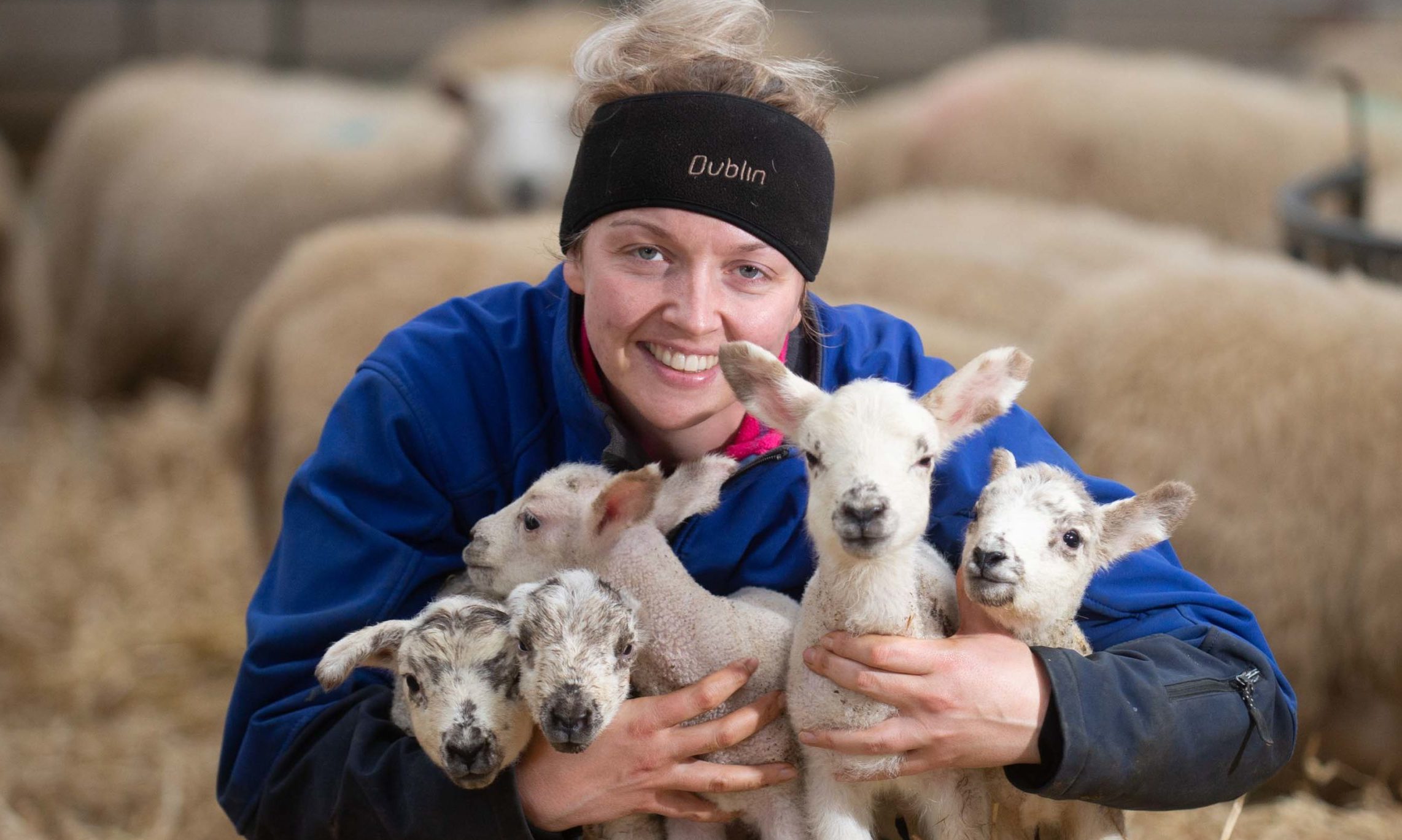 Emma Reid with the five healthy lambs.