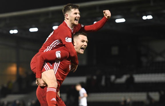 Aberdeen's Matty Kennedy and Mikey Devlin, right, after the win over St Mirren in Paisley.