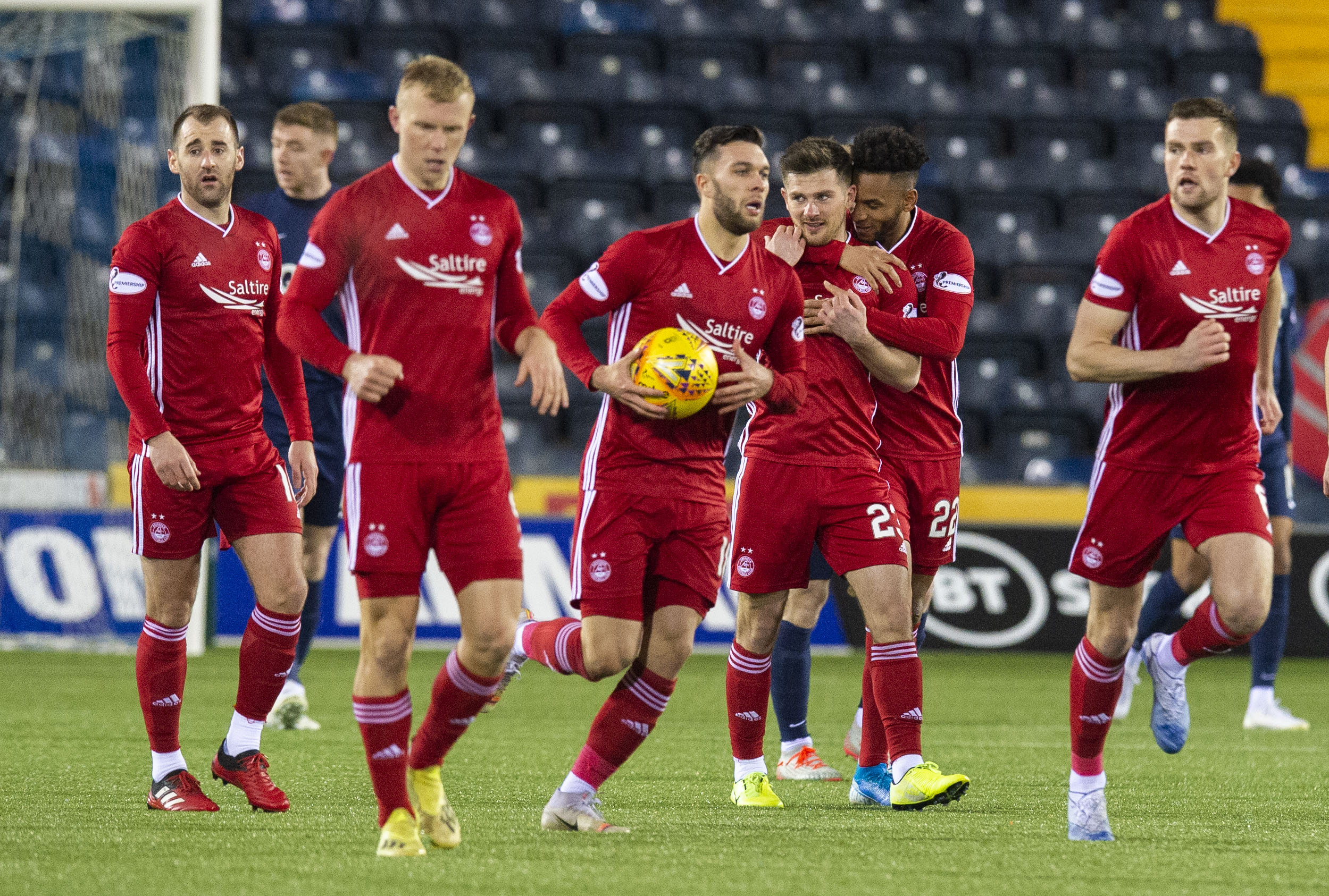Aberdeen's players hurry to get play restarted after drawing level.