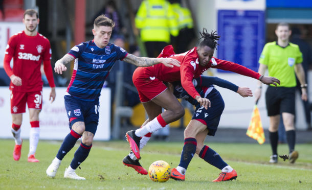 Ross County's Josh Mullin (L) and Marcus Fraser (R) are pictured in action with Rangers' Joe Aribo.