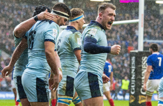 Scotland celebrate Stuart McInally's try.