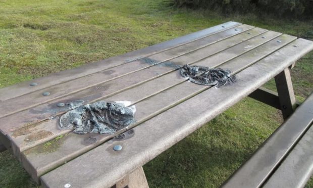 A picnic bench at Balmedie Beach was melted after disposable barbecues were placed on top of it.