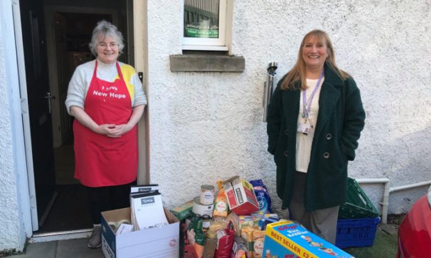 Theresa Bain, pictured right, delivers food to Hope Kitchen in Oban.