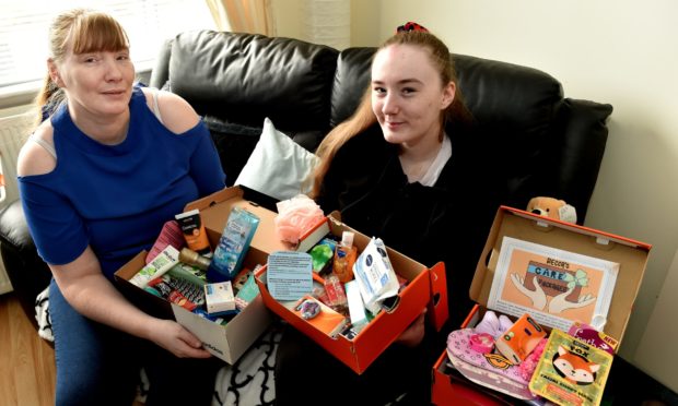 Becca Hammell delivers care packages with her mum Angela. Picture by Colin Rennie.