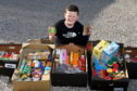 Ross Sharp has been collecting food every day to donate to the local foodbank.

Picture by Kenny Elrick