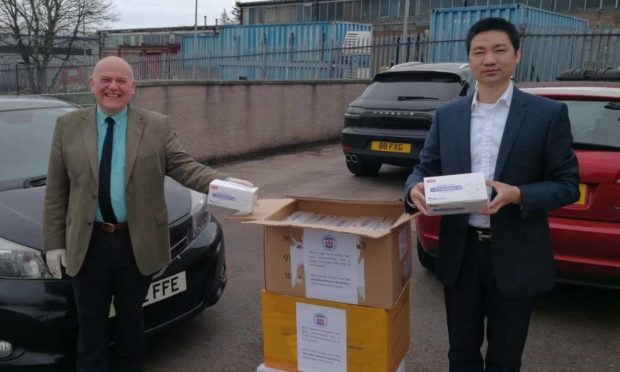 Lord Provost Barney Crockett with Wengang Lui, president of the UK Aberdeen Chinese Association.