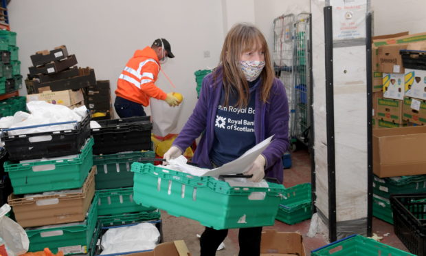 Volunteers at Community Food Initiatives North East sorting out food deliveries.