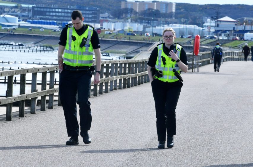 Police at Aberdeen Beach. Picture by Chris Sumner.