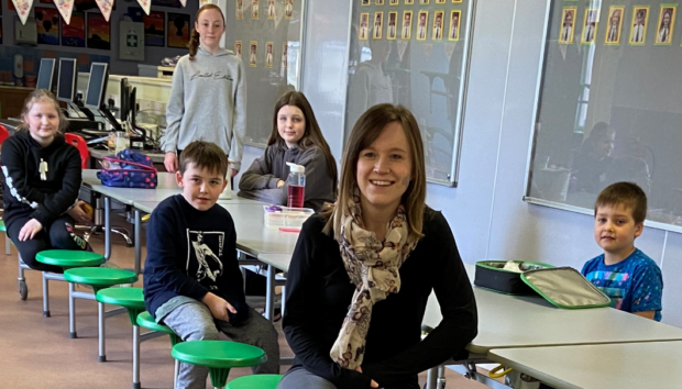 Emma Petrie with children at Greenwards Primary School.