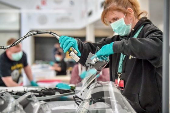 PPE being assembled on a production line