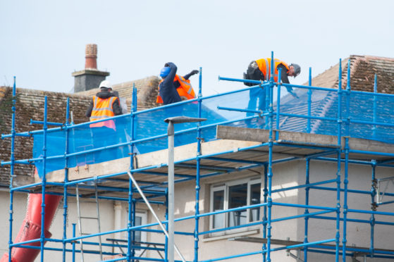 Work being undertaken on military homes on South Covesea Terrace in Lossiemouth.