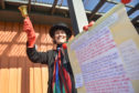 Town Criers Roy Miles and Laura Pasetti delivering messages to the town. Picture by Jason Hedges.