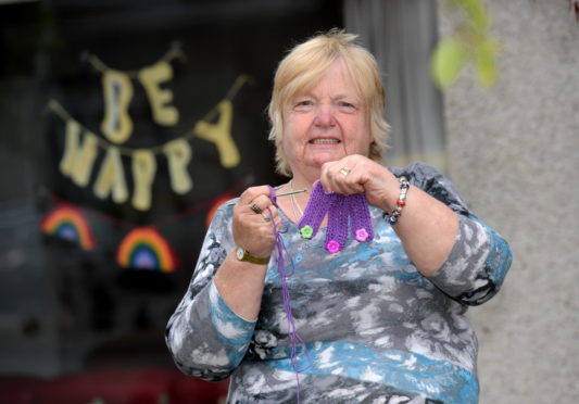 Patsy Jardine has been crocheting ear savers for people in the community so their ears don't hurt when they wear masks. 
Picture by Kath Flannery.