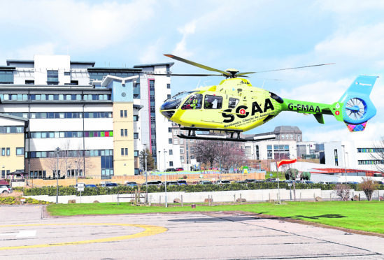 The new Scotland's Charity Air Ambulance (SCAA) Helimed 79 based at Aberdeen Airport touches down at Aberdeen Royal Infirmary (ARI) on a test flight on it's first day of operations during a practice run.
Picture by Kami Thomson