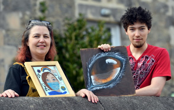 Stephanie Walby and her son Luke Allsop show off some of their artwork.    
Picture by Kami Thomson.