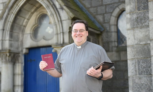 Reverend Peter Johnston outside his church

Picture by Paul Glendell