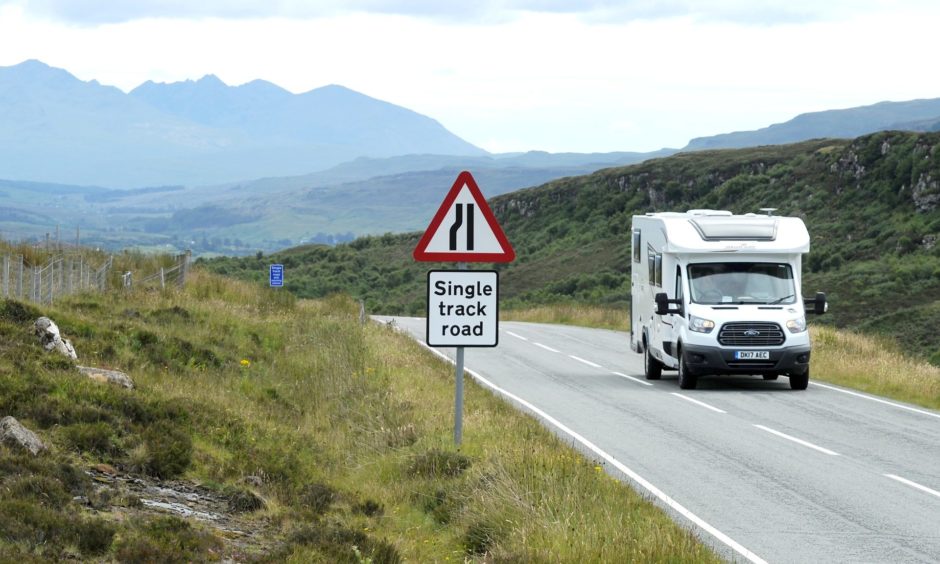 Motorhome on the A855 north of Portree, with the Cuillin Ridge as a backdrop.