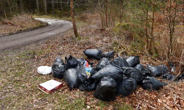 Fly-tipping at Clootie Well car park near Munlochy. Picture by Sandy McCook.