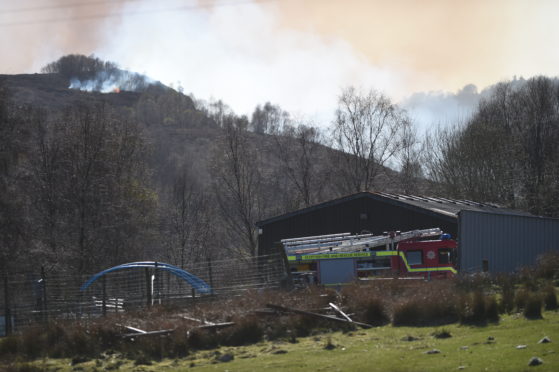 Fire crews at the scene of the wildfire. Picture by Jason Hedges.