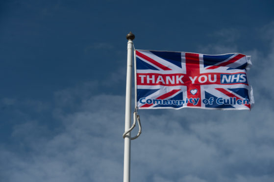 The flag is at the summit of Castle Hill in Cullen.