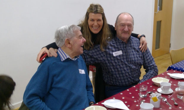 Ingrid Penny from Scottish War Blinded - now Sight Scotland Veterans - with two veterans at a pre-lockdown lunch club.