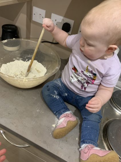 Making a good job of stirring things up is Zara Martin, aged one, from Aberdeen