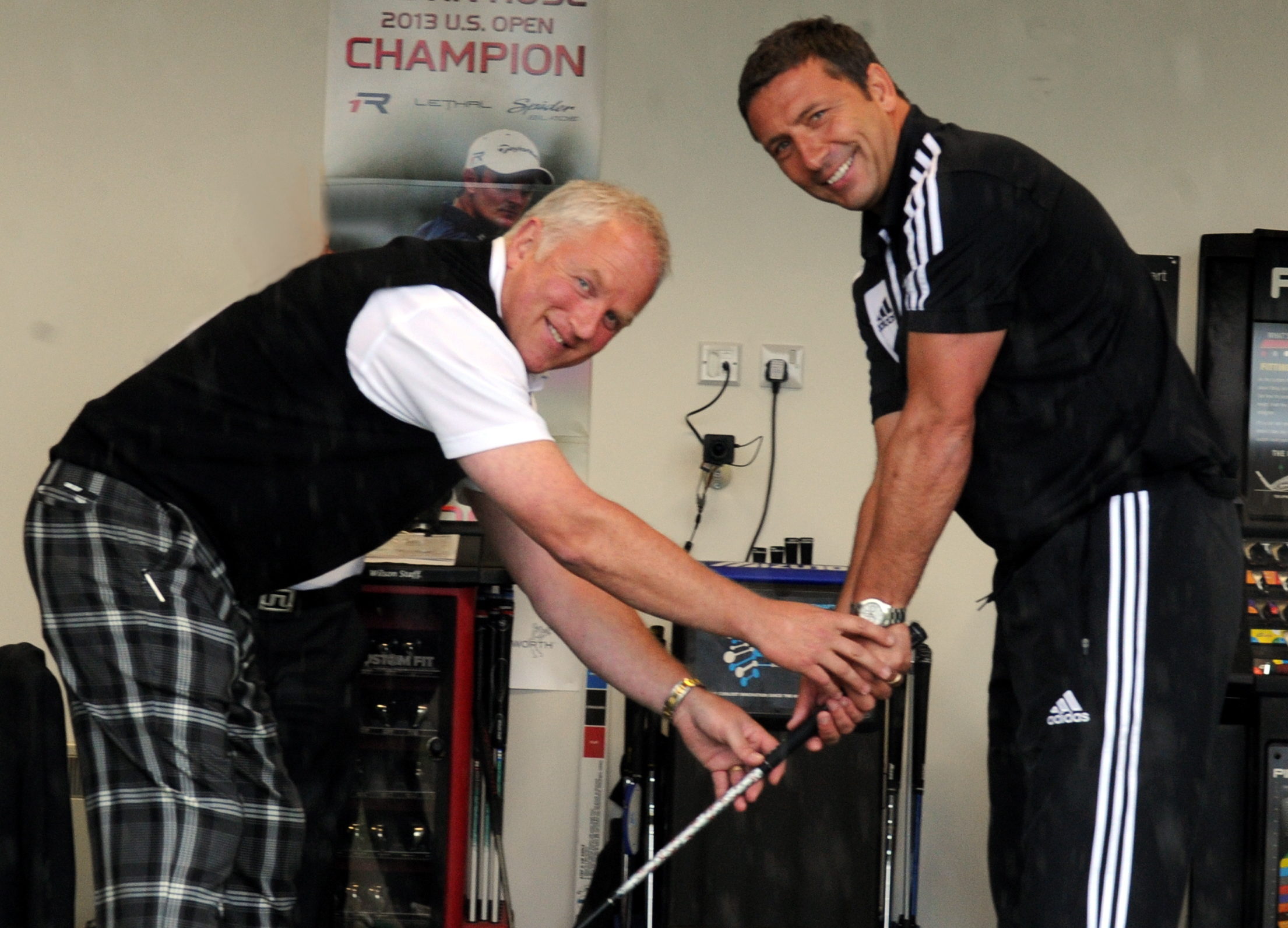 Paul Girvan helping Aberdeen manager Derek McInnes with his swing. 
Picture by Jim Irvine