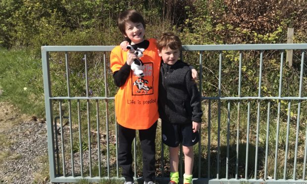Caleb and Joseph Nicholson walked three miles for charity.