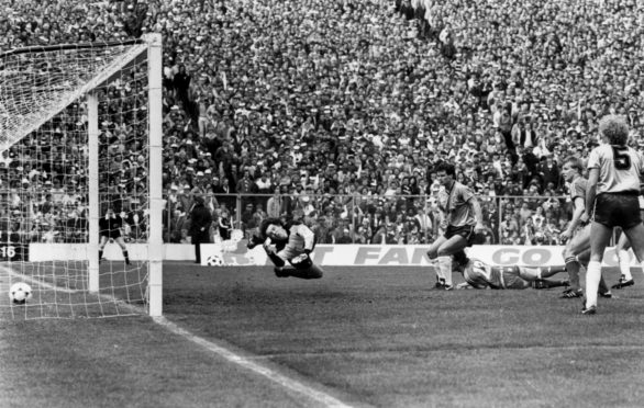 Billy Stark makes it 3-0 with a spectacular diving header at Hampden.