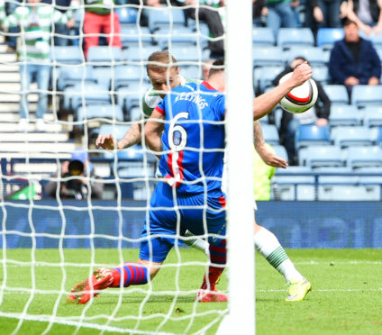 Inverness CT's Josh Meekings appears to handle a header from Leigh Griffiths
