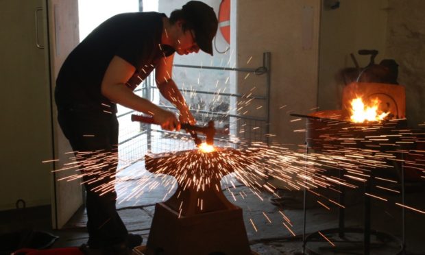 Bryden Jacobson hard at work in Brokkr Forge in Shetland.