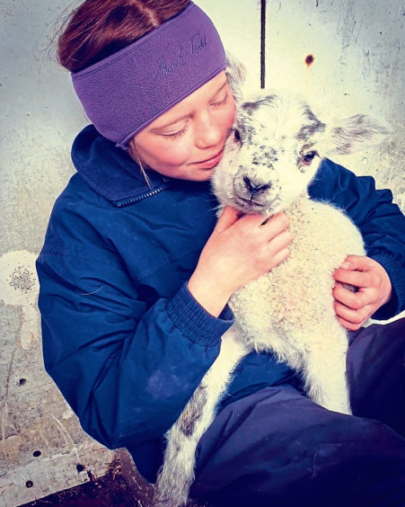 Fiona Leslie sent in this picture of 10-year-old Robyn-Mae Leslie from Lonmay with her favourite pet lamb named John.