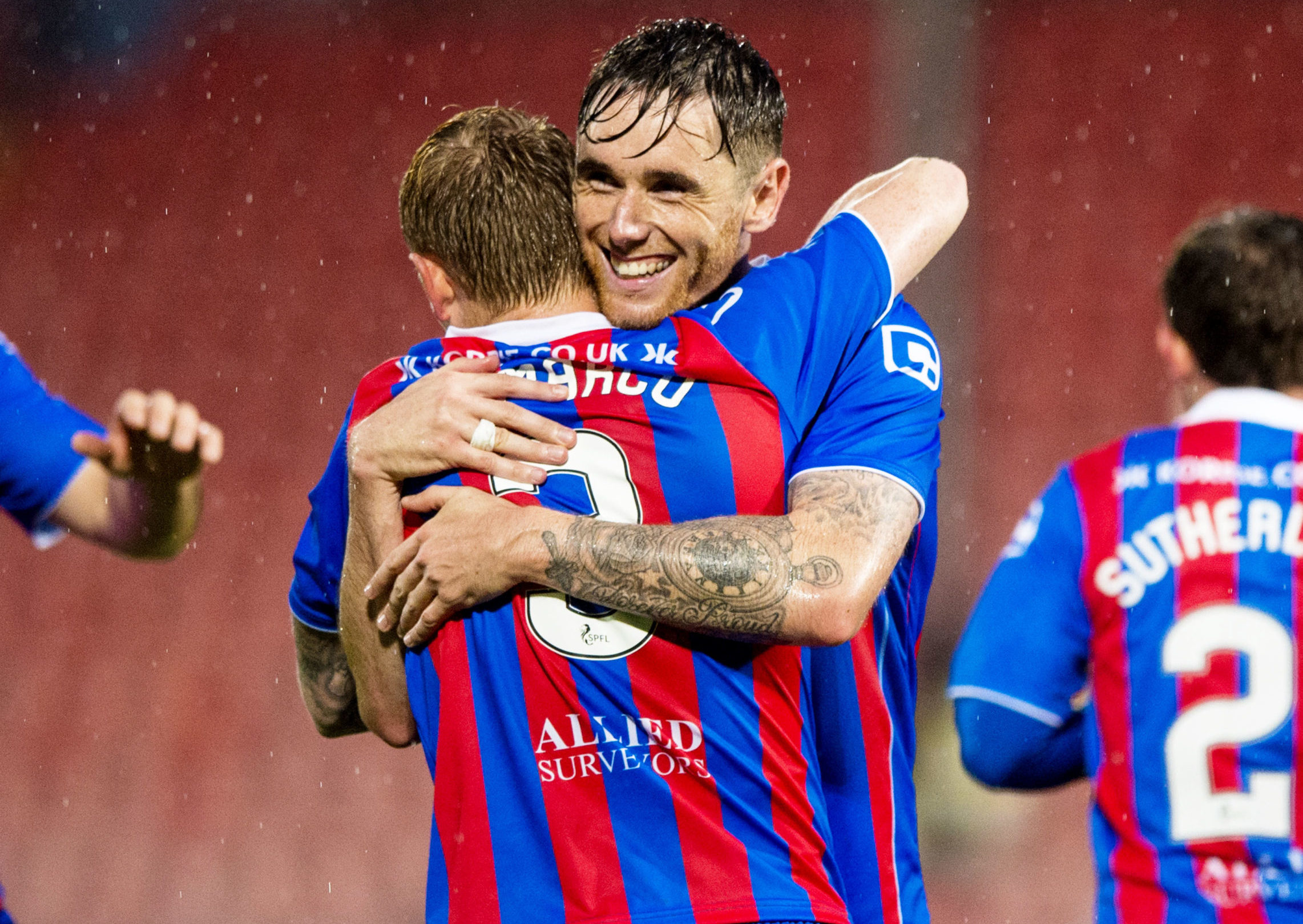 Greg Tansey celebrates with Carl Tremarco during a game against Dunfermline.