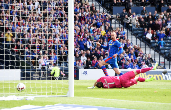 James Vincent slides home the goal that won Caley Thistle the Scottish Cup