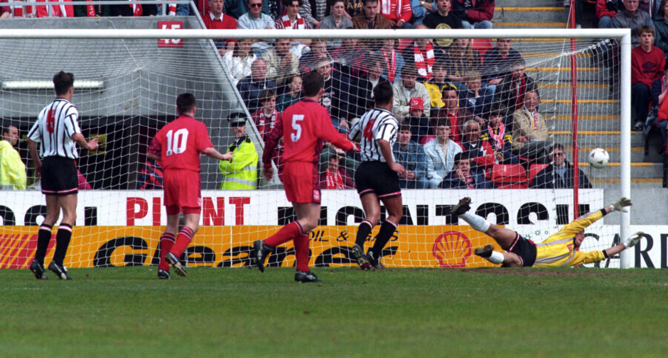 Craig Robertson (out of frame) scores a consolation goal for Dunfermline.