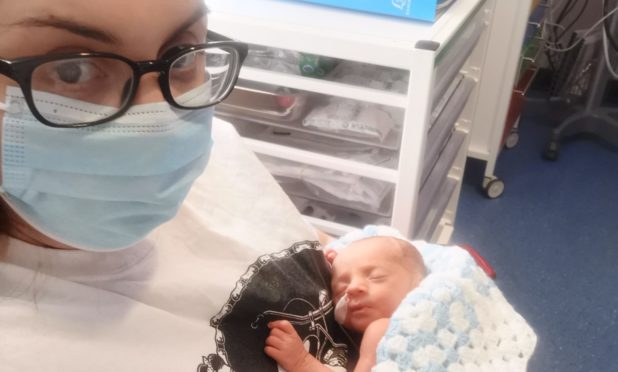 Cher Gaitens with baby William, whose arrival eight weeks early took his proud parents by surprise