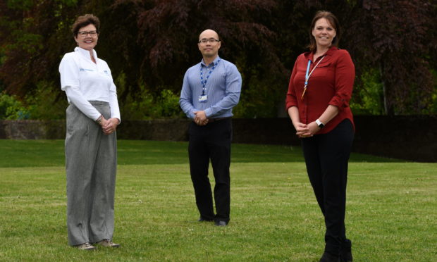 New volunteer Alison Bandeen with NHS Grampian head of business services Preston Gan and patient services manager Louise Ballantyne. Picture by Kenny Elrick