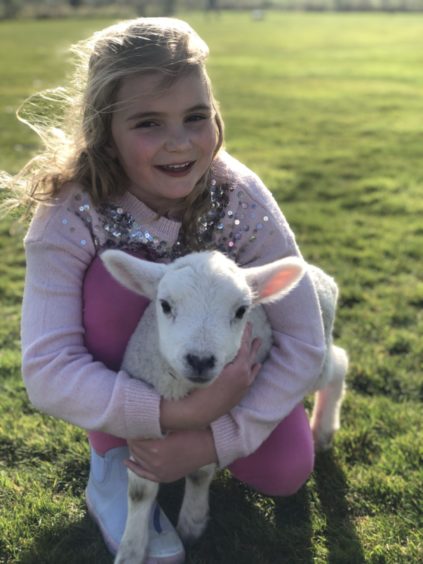 Beth Davidson with pet lamb Mabel at
Moss-Side farm, Oldmeldrum.