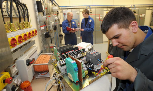 Students Bob Allan, Alex Hutchinson and Edward Padel at the Epit facility.