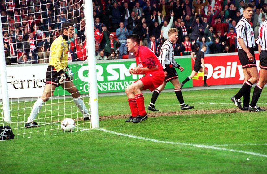 Scott Thomson scores Aberdeen's third.