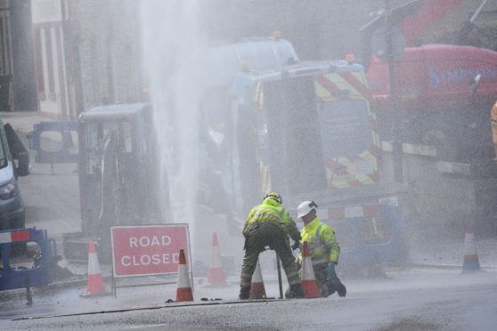 Scottish water engineers work on Williamson Street in Wick.