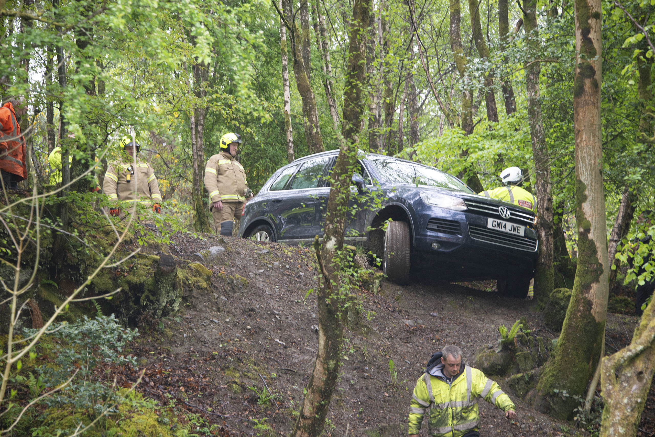 Volkswagen 4x4 hangs over the edge of a 15 foot drop in Fort William after the driver tried to take his car up a steep and winding Forestry Commission footpath.