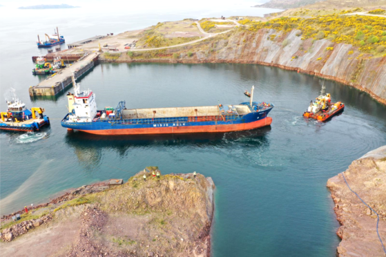 The MV Kaami docking in Kishorn after being taken under tow from The Minch