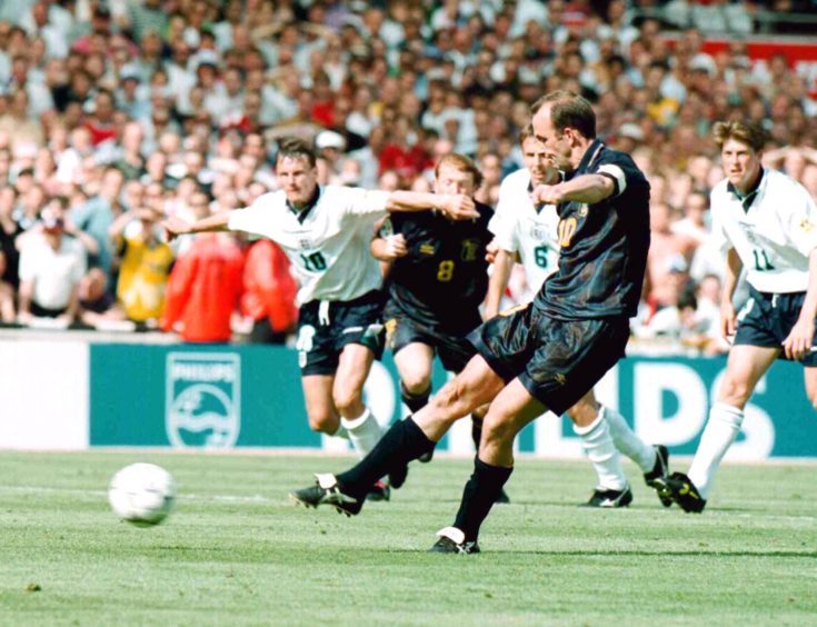 Scotland captain Gary McAllister steps up to hit a penalty but fails to score.