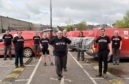 Staff at the Inverurie Royal Mail Delivery Office with their special T-shirts. Picture by Darrell Benns.