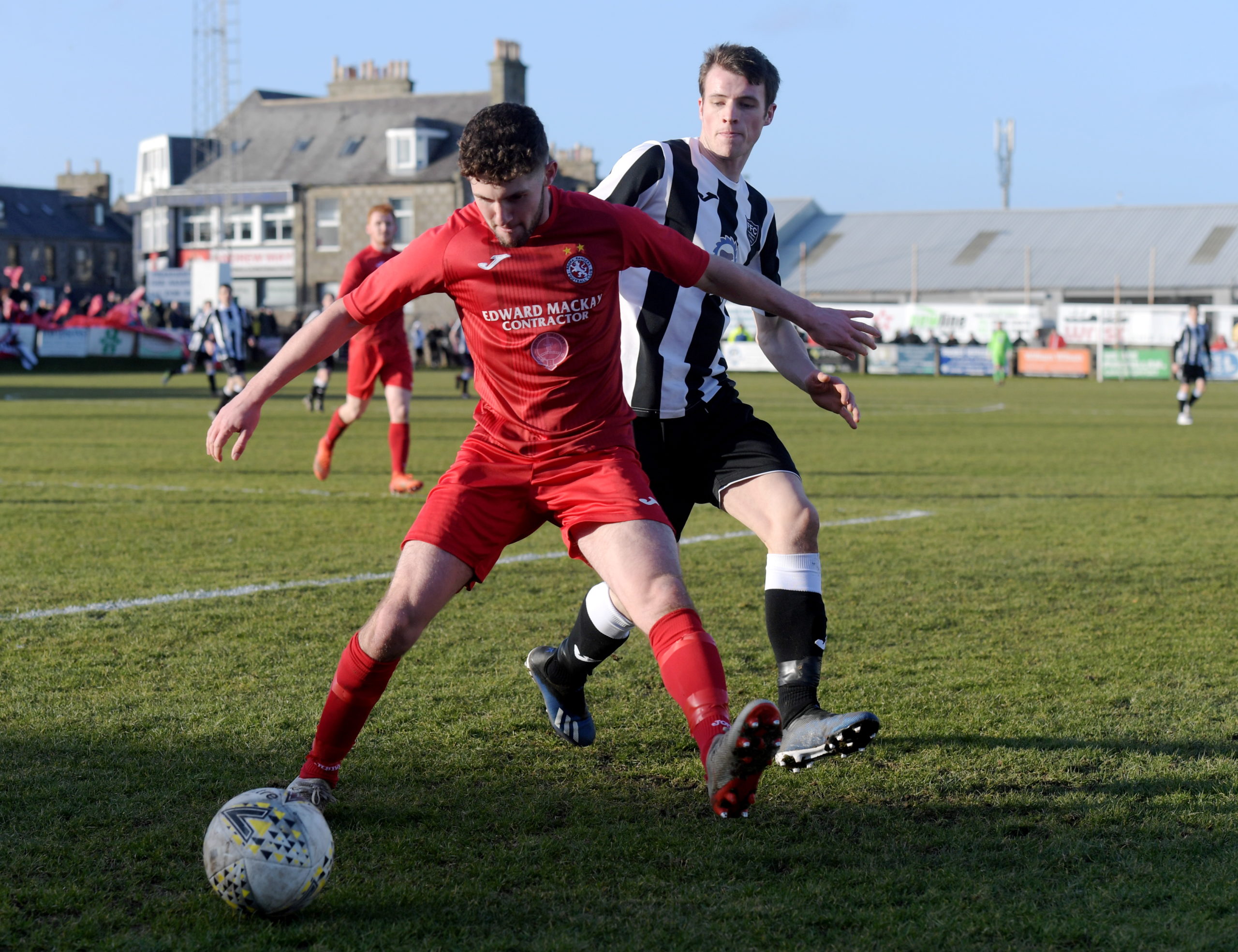 Tom Kelly (left) won the title with Brora Rangers this season