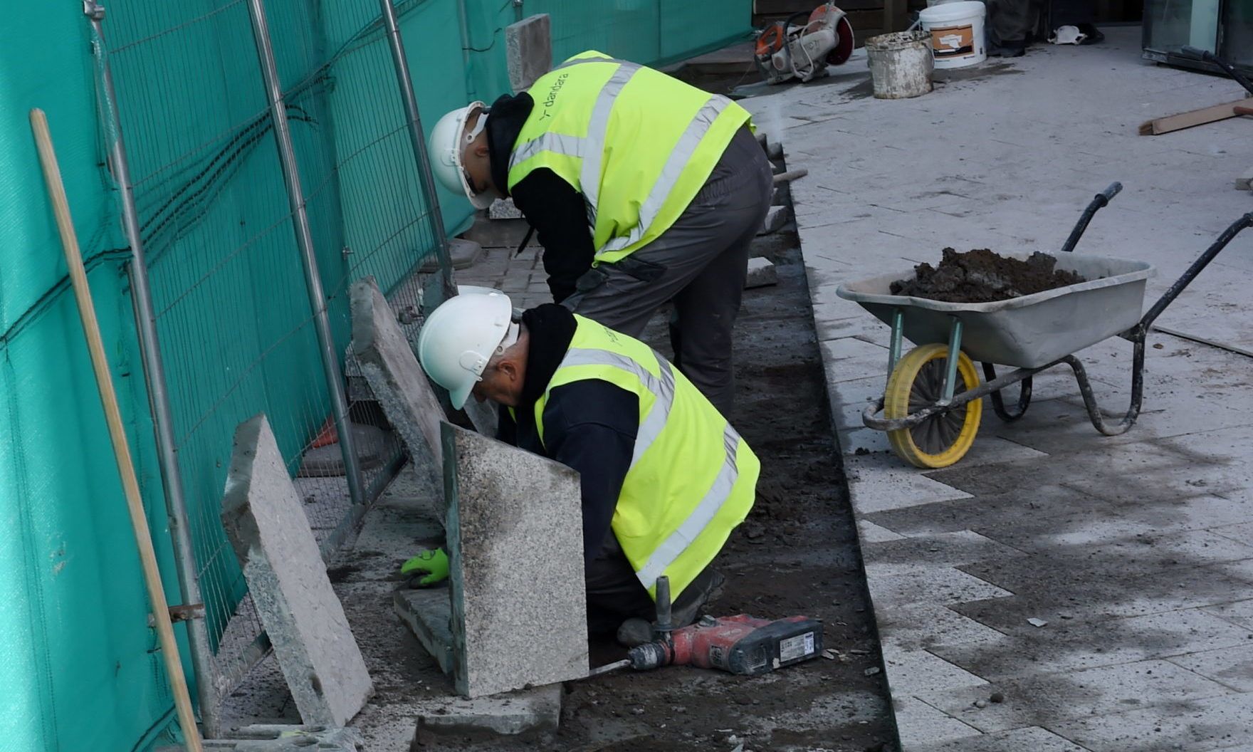 Workers laying paving in Schoolhill at Dandara’s development at the Triple Kirks in Aberdeen during lockdown.