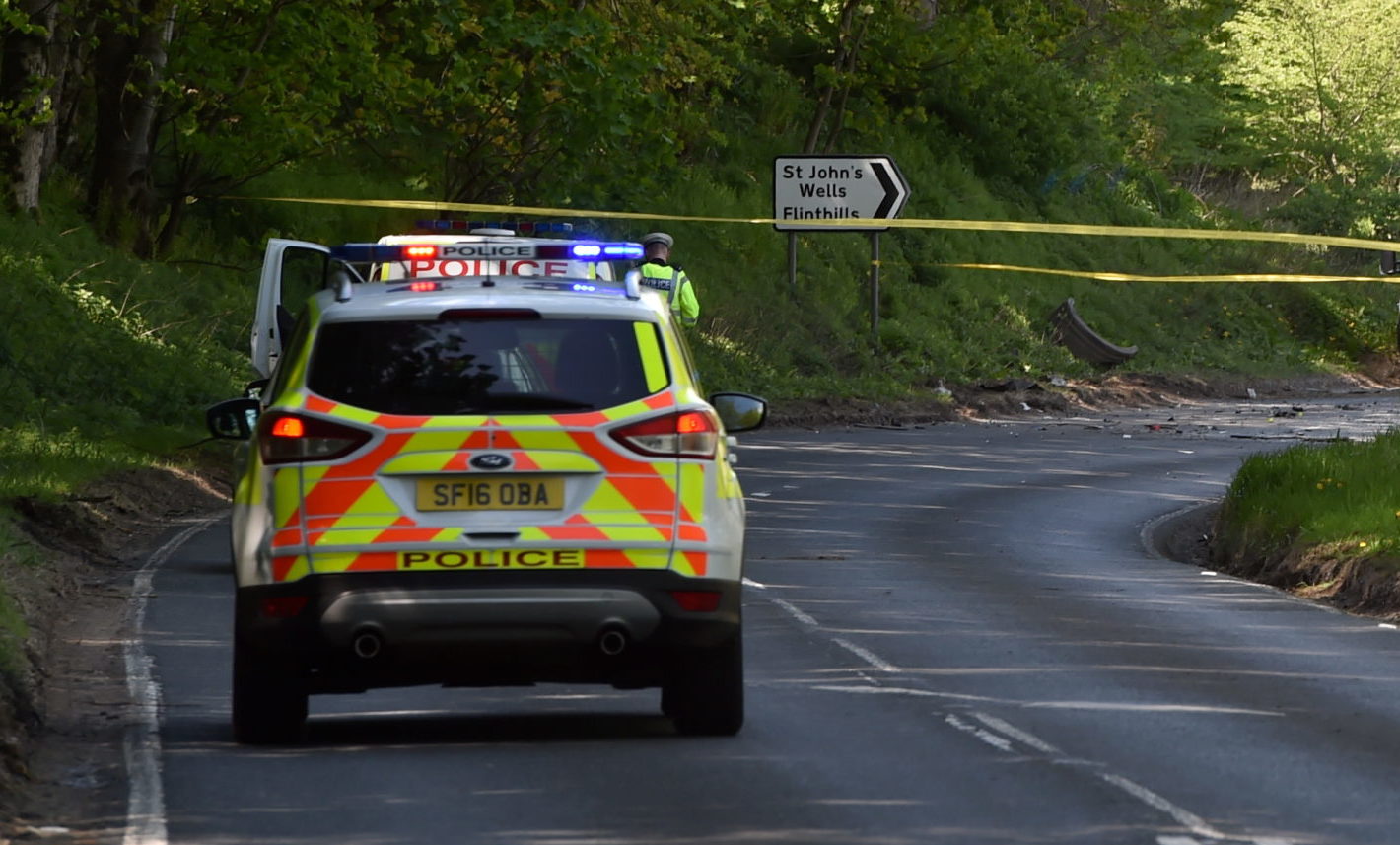 Police remain at the site of the A947 crash near Fyvie.
Picture by Kenny Elrick