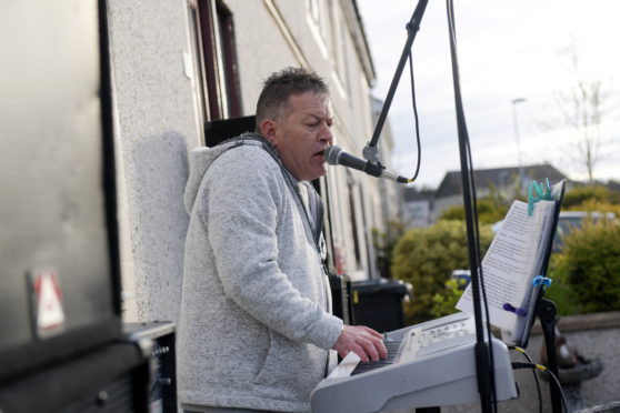 Adam Lawrence has been playing live music every Thursday in time for the NHS clap for the NHS. 
Picture by Kath Flannery.