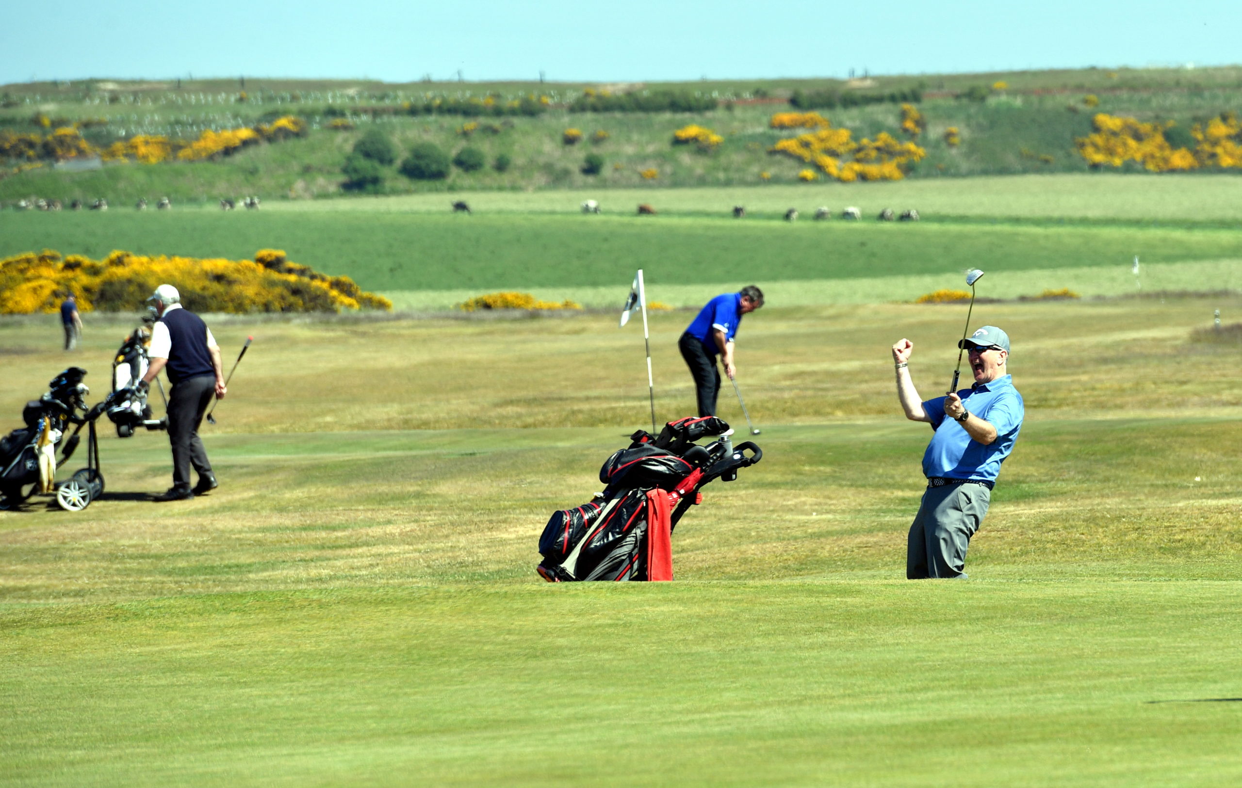 One golfer celebrates as Murcar Links Golf Club reopens thanks to the easing of restrictions.   
Picture by Kami Thomson